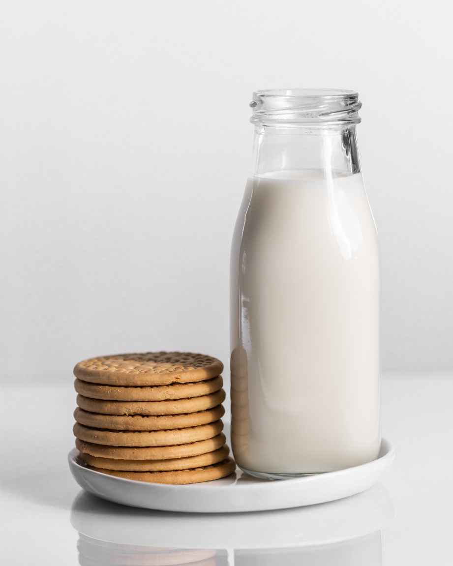 A Bottle of Milk and Biscuits on a Plate 